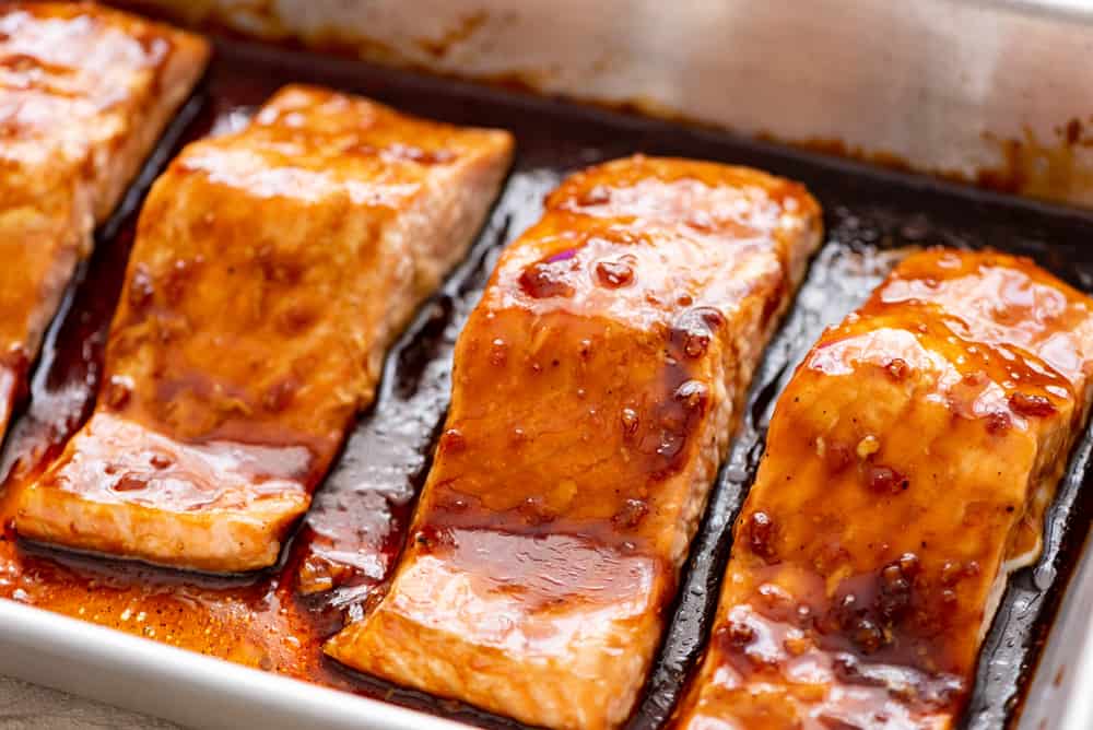Baked Sesame Teriyaki Salmon is a five star salmon baked with the best homemade sesame teriyaki sauce. This is easily one of the best things that you will eat! getting ready to bake teriyaki salmon in the oven