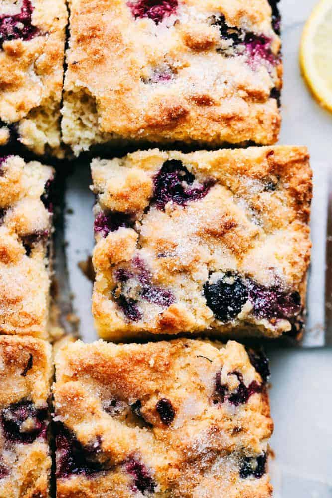 Blueberry buttermilk breakfast cake is so easy to throw together for breakfast. It is incredibly moist, buttery, and bursting with fresh blueberries inside. One piece is never enough! Closeup of Blueberry Buttermilk Breakfast Cake slice.