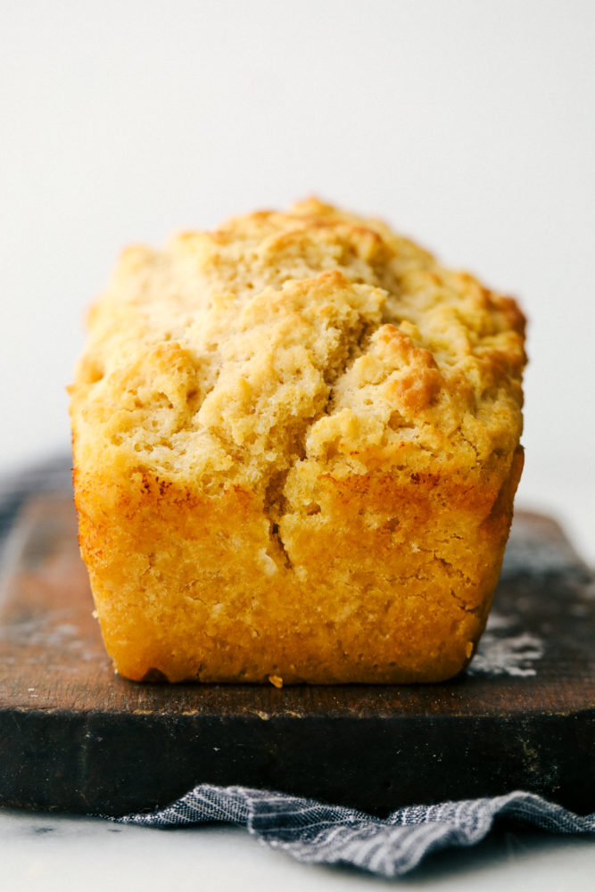 Buttery beer bread loaf in a photo. 