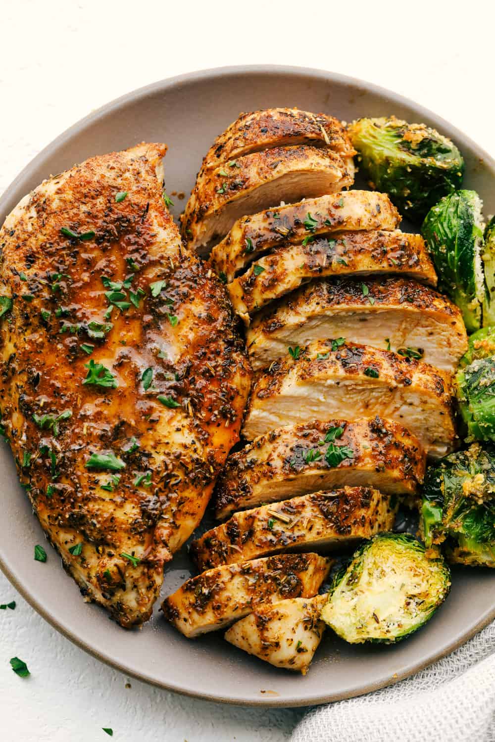 With this Air Fyer Chicken recipe, I am going to show you how to make the most insanely tender and juicy chicken! The secret? The incredible seasonings! They create a nice golden, crispy outside with a juicy, flavor-packed inside! Tender Juicy Air Fryer Chicken with Brussel Sprouts
