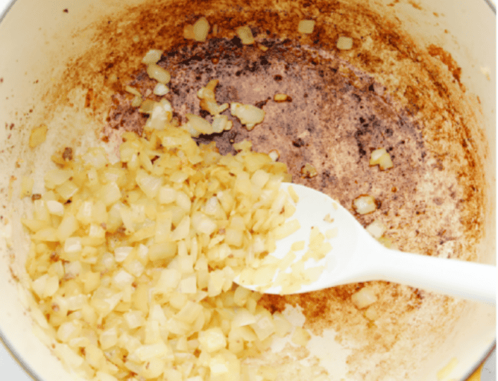Onions cooking with garlic in the pot